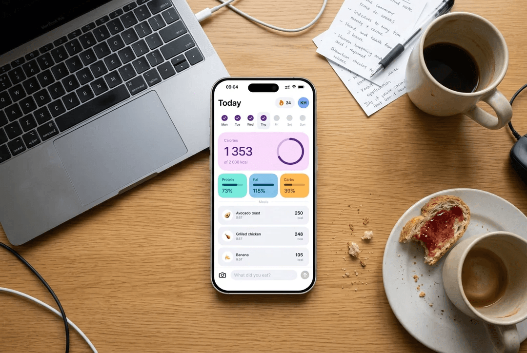 Yaaam app on iPhone, on a desk with laptop and coffee